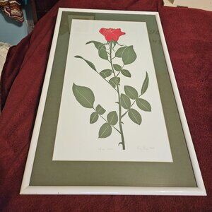 picture with a long stem red rose signed and numbered by artist dated 1988